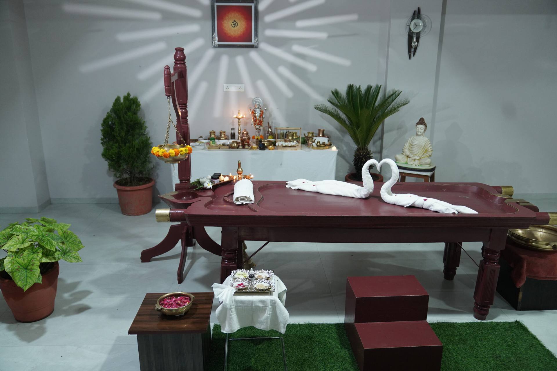 Traditional Ayurvedic therapy room with a wooden Panchakarma table at Dr Bangard's Sattva Healthcare, Bhopal